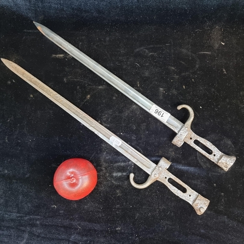 196 - A pair of antique steel sword bayonets. Length of blade 40cm