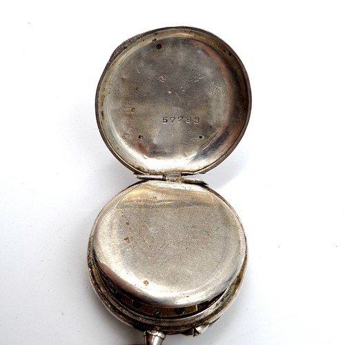 6 - A fine example of a Sterling silver cased fob watch, featuring an enamelled figure dial and gilded a... 