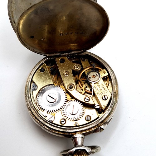 6 - A fine example of a Sterling silver cased fob watch, featuring an enamelled figure dial and gilded a... 