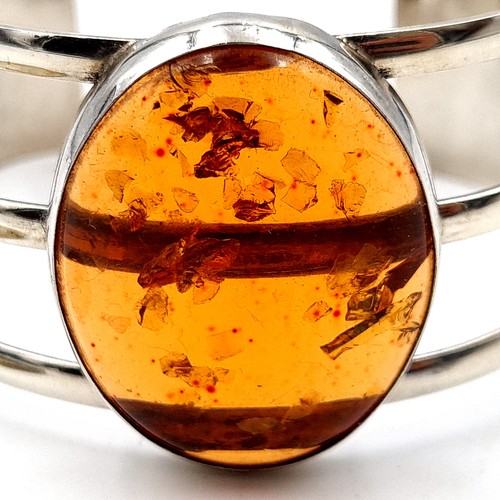 10 - A beautiful natural Baltic Amber sterling silver cuff bracelet, featuring a stunning central Amber s... 