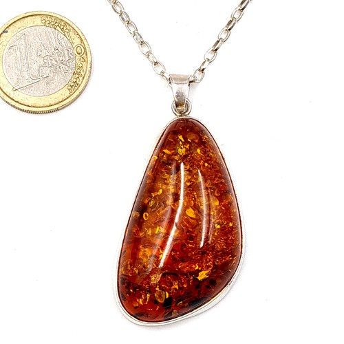 11 - A striking and generous sterling silver natural Baltic Amber pendant chain necklace. Length of chain... 