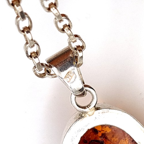 11 - A striking and generous sterling silver natural Baltic Amber pendant chain necklace. Length of chain... 