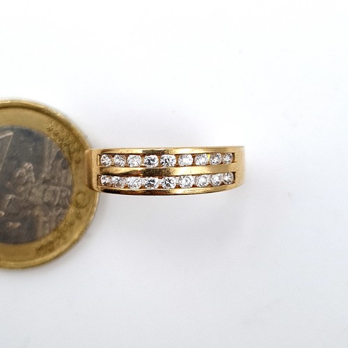 15 - A beautiful and heavy 9 carat gold channel set White Sapphire half eternity ring. Stamped 375. Ring ... 