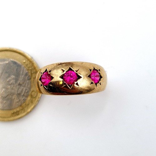 17 - Star Lot :  fine example of a vintage 9 carat gold Bohemian style three stone Ruby ring. Stamped 375... 