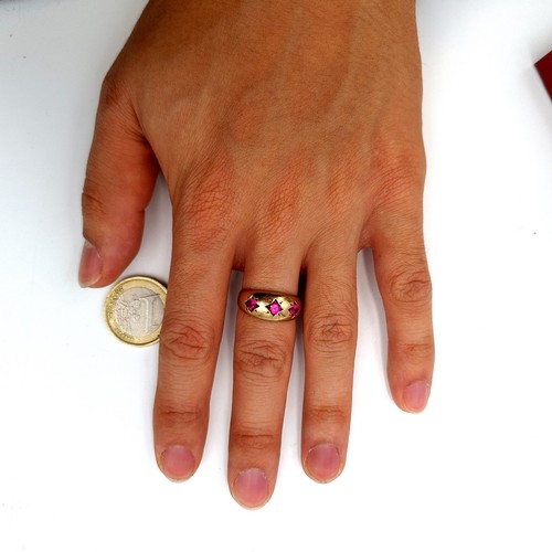 17 - Star Lot :  fine example of a vintage 9 carat gold Bohemian style three stone Ruby ring. Stamped 375... 