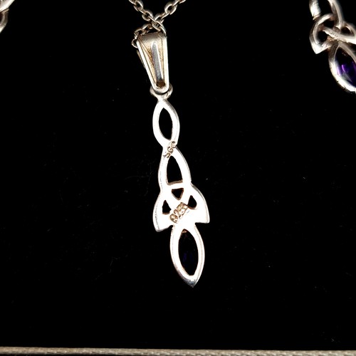 26 - A Celtic sterling silver pendant necklace, featuring Amethyst stone detail and accompanied by a pair... 