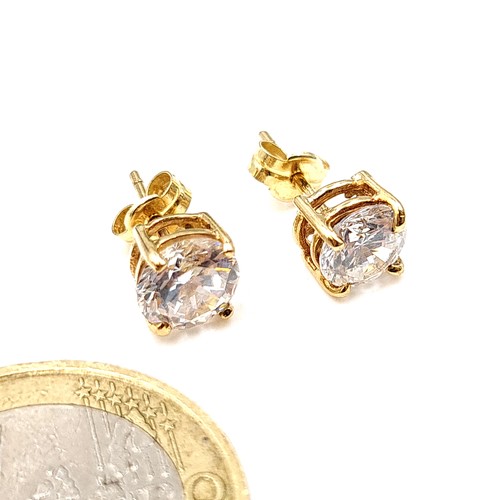 27 - A beautiful pair of 9 carat gold (stamped to posts) gem stone stud earrings, set with butterfly back... 