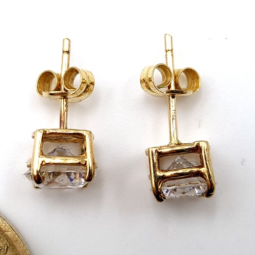 27 - A beautiful pair of 9 carat gold (stamped to posts) gem stone stud earrings, set with butterfly back... 