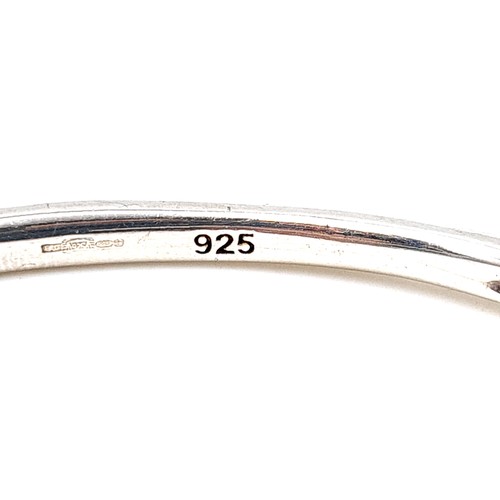 29 - A finely crafted unusual sterling silver contemporary style bangle, with a weight of 12.52 grams. St... 