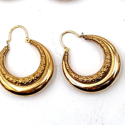 30 - An assorted collection of seven pairs of rolled gold hooped and stud earrings, each featuring a Bohe... 