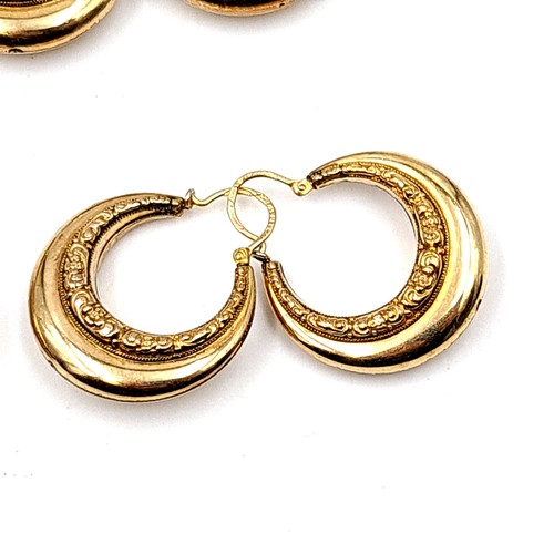 30 - An assorted collection of seven pairs of rolled gold hooped and stud earrings, each featuring a Bohe... 