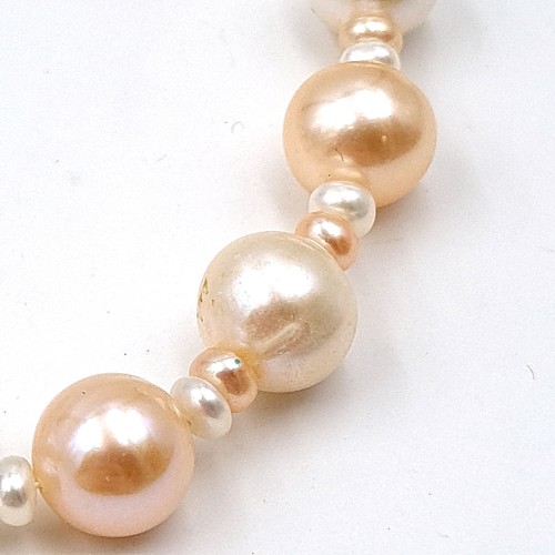 32 - Two very attractive sterling silver set Fresh Water Pearl necklaces, the first is a floating style t... 