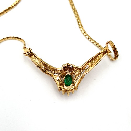 36 - Star Lot: A truly exquisite Emerald and Diamond 10 carat gold pendant necklace, featuring a beautifu... 