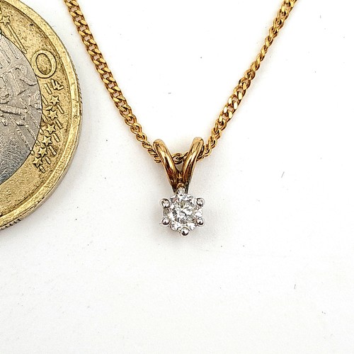 39 - Star Lot: A beautiful 9 carat gold Diamond solitaire necklace, featuring a bright sparkling central ... 