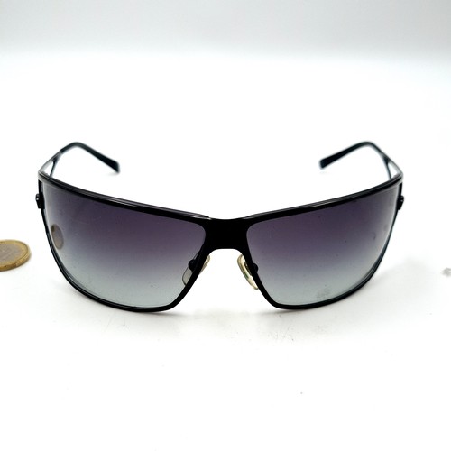 43 - A stylish pair of wrap around original designer Versace Italian made sunglasses. Featuring dark lens... 