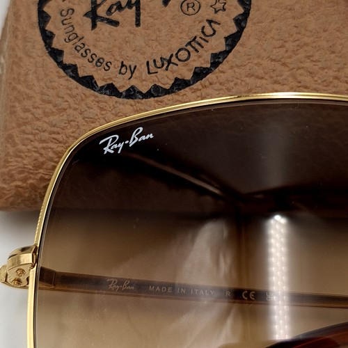 48 - A pair of genuine 1970's inspired style Ray-Ban sunglasses, set with G15 brown dual toned lenses and... 