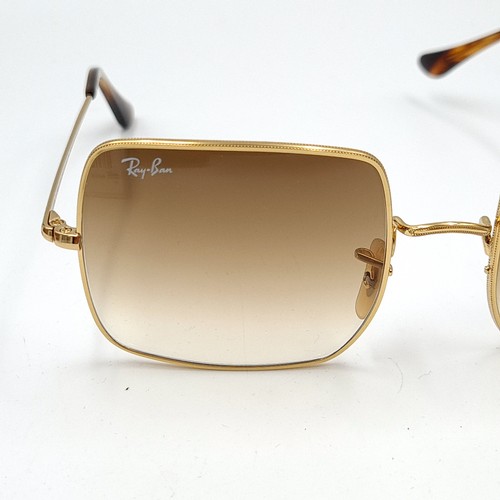 48 - A pair of genuine 1970's inspired style Ray-Ban sunglasses, set with G15 brown dual toned lenses and... 