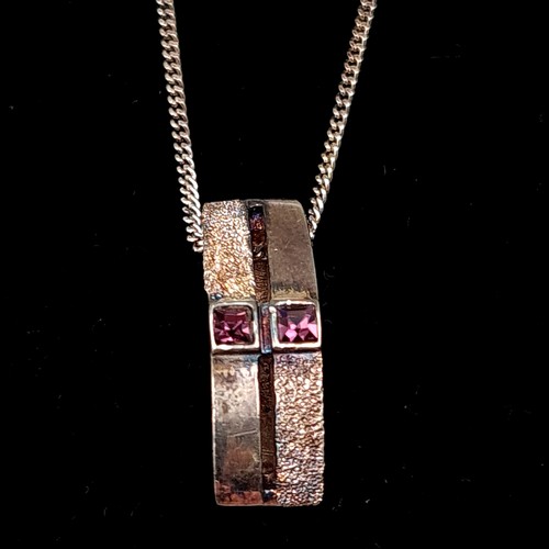 56 - A sterling silver Amethyst stone channel pendant, set with sterling silver chain. Length: 40cm.