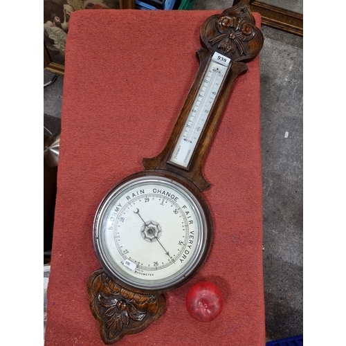 939 - A beautiful example of a victorian banjo barometer with a carved wooden frame and glass panels.