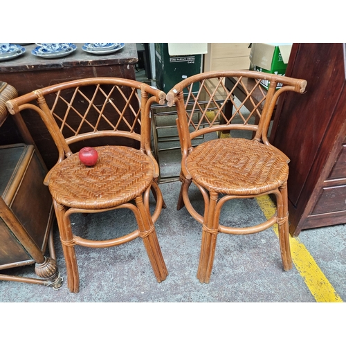 572 - A pair of vintage bentwood chairs with rattan seats and lattice backrest. Both in great condition.