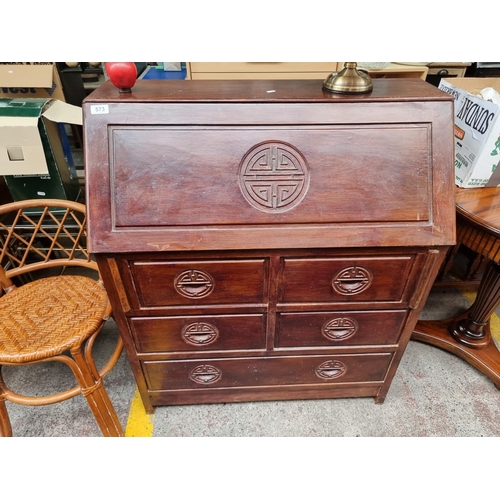 573 - A handsome vintage writing desk with carved Chinese ''Good Luck'' emblem handles. Featuring five dra... 