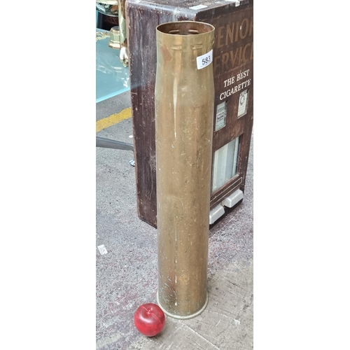 583 - A large vintage brass artillery shell. H68cm