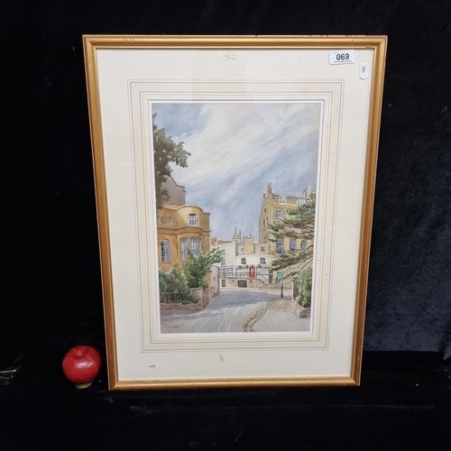 69 - A beautiful original watercolour on paper painting featuring an English town on a summers day. A ski... 