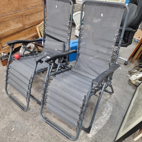 1007 - A pair of Florabest folding garden chairs. With back power coated metal frame and vinyl seats.