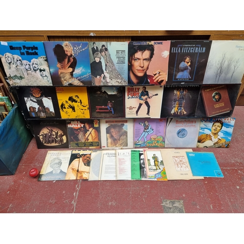 1015 - A selection of twenty-seven vintage vinyl records. Including artists David Bowie, Bee Gees, Fleetwoo... 