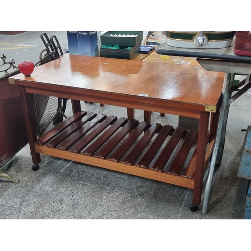 868 - A military style two tier vintage coffee table with brass corners. . With slatted wood tier to base ... 