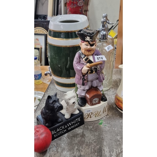 874 - Two pieces of pub memorabilia including a figure of the iconic Black & White scotty dogs along with ... 