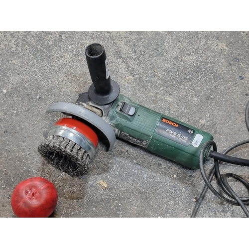 877 - A Bosch PWS 6-115 corded angle grinder. 220w with a heavy metal brush attachment.