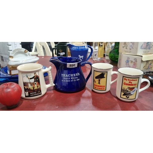 890 - Four pieces of vintage original pub memorabilia including a Teachers Scotch Whisky jug, two Guinness... 