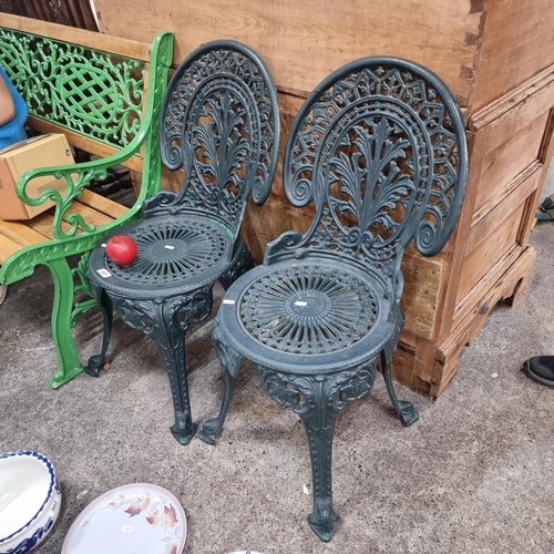 901 - A pair of heavy antiques cast iron garden chairs with lovely pierced foliate and scroll design throu... 