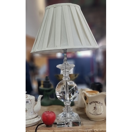 905 - A stylish contemporary table lamp with a very heavy weighted lucite and chrome stem, topped with a p... 