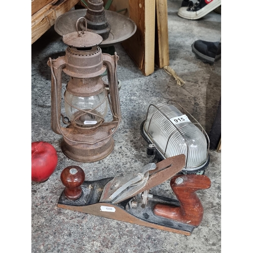 915 - Three vintage and antique items including a West German kerosene lamp, a Ross wood plane and an indu... 