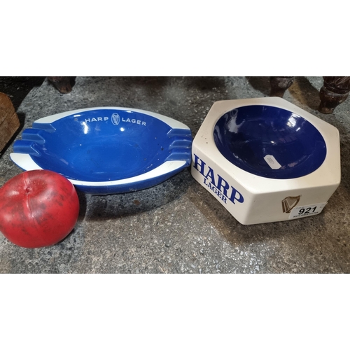 921 - Two Harp ashtrays advertising Harp Lager by Wade and Gresley Ware. Both very good condition.