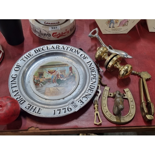 930 - Nine items including a pewter plate celebrating US independence  and brass items such as a horse sho... 