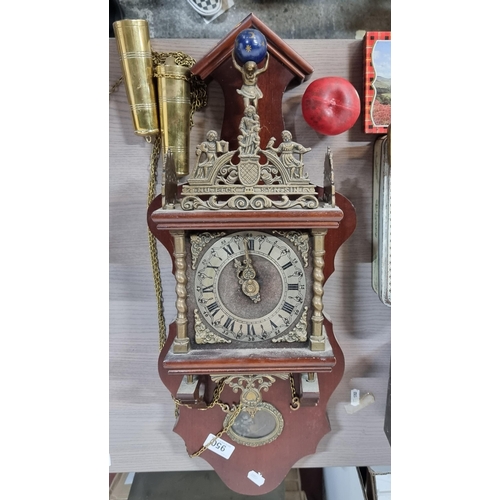 950 - A fabulous vintage German made Dutch atlas wall clock with intricate brass detail featuring a figure... 