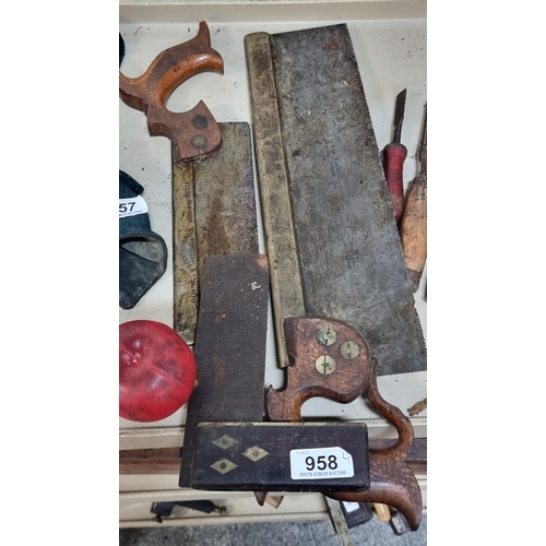 958 - Three vintage woodworking carpenters tools. Includes two cast Sheffield steel handsaws, branded F.G.... 