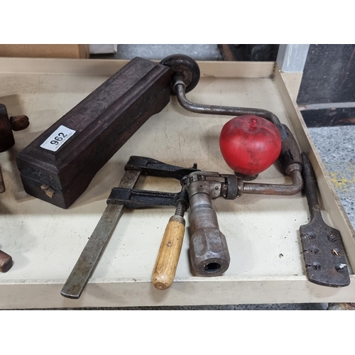 962 - Four vintage woodworking tools including a fabulous wooden mounted sharpening stone, clamp and hand ... 