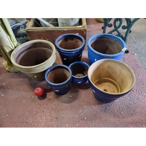 992 - A mixed selection of six large ceramic planters. Including four in a dark blue glaze. All with drain... 