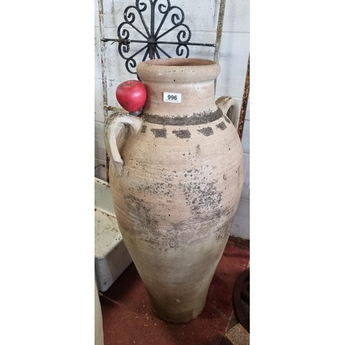 996 - Star Lot - A large terracotta Amphora floor-standing vase. Featuring textured comb pattern and two s... 