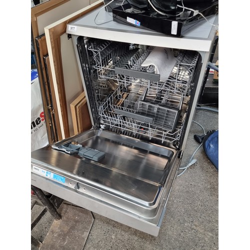 977 - A Zanussi Dishwasher (Model ZSF6128). A++ rated with a three pin plug. Presented with original model... 