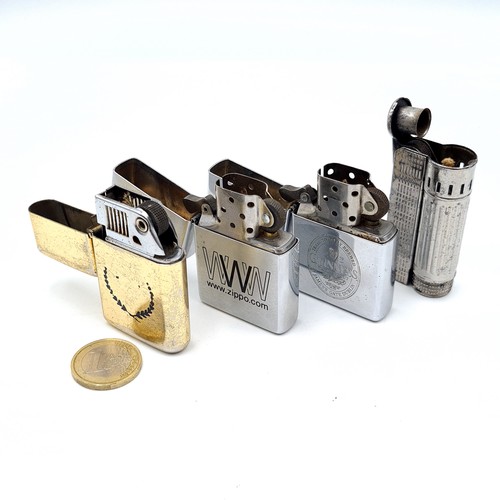 7 - A collection of four flint lock lighters, comprising of modern and vintage design. This includes a v... 