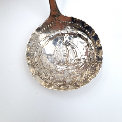 27 - A fine example of a Victorian hammered sterling silver caddy spoon, featuring an unusual dotted bowl... 