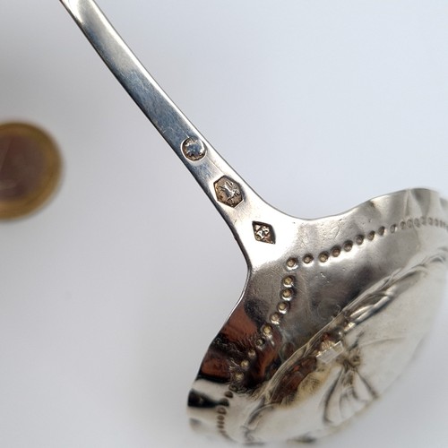 27 - A fine example of a Victorian hammered sterling silver caddy spoon, featuring an unusual dotted bowl... 