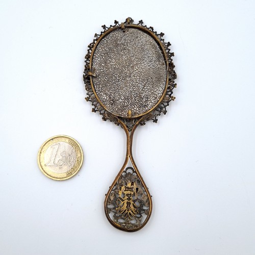 28 - A very pretty French inspired bevelled antique hand mirror, featuring a profuse lattice foliate rim ... 