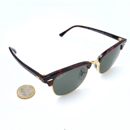 43 - A pair of genuine Ray-Ban faux tortoiseshell framed sunglasses, featuring dark lenses. In good, clea... 