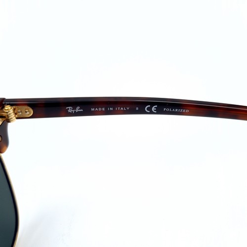 43 - A pair of genuine Ray-Ban faux tortoiseshell framed sunglasses, featuring dark lenses. In good, clea... 